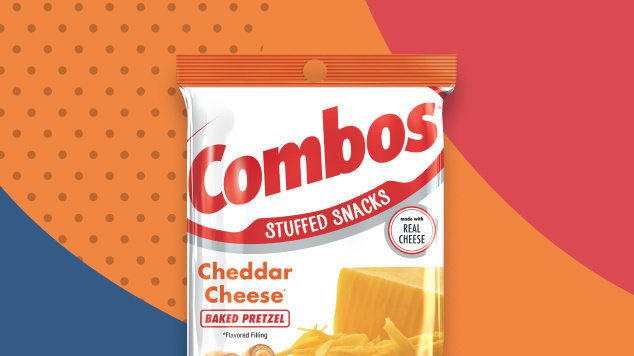 Bag of Cheddar Cheese Baked Pretzel Combos on a blue, orange and red patterned background