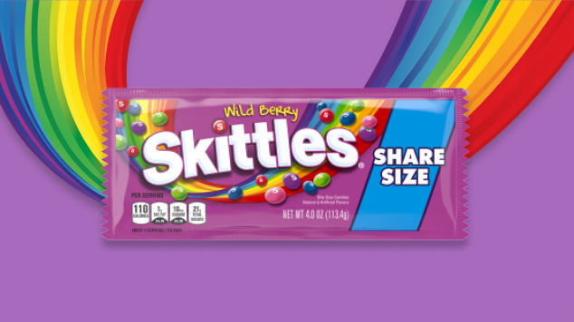 Skittles wild berry chewy share size with purple and rainbow background 