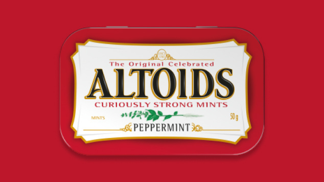Tin of Peppermint Altoids on a red background