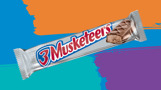 Packaged 3 Musketeers original chocolate shareable size on colorful background