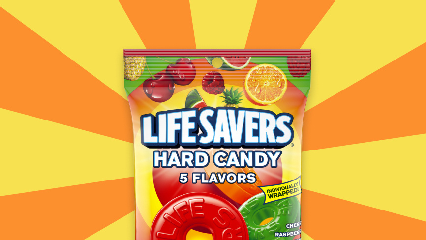 Packaged Life Savers hard candies in front of colored pattern