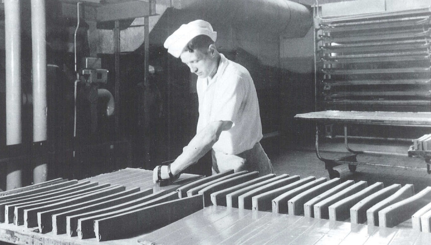 Black and white photo of young man working in a Mars factory