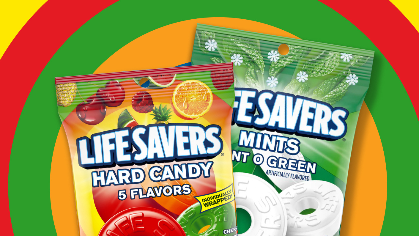 Packaged Life Savers hard candies and mints on top of colorful background