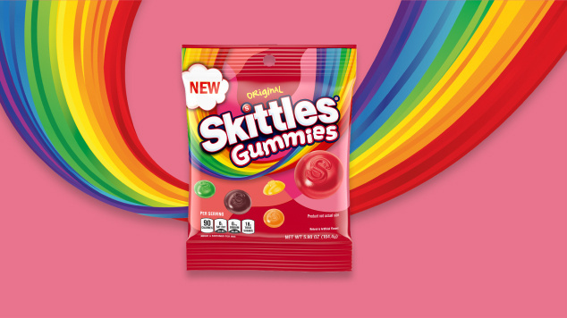 Skittles gummies original bag with pink and rainbow background 