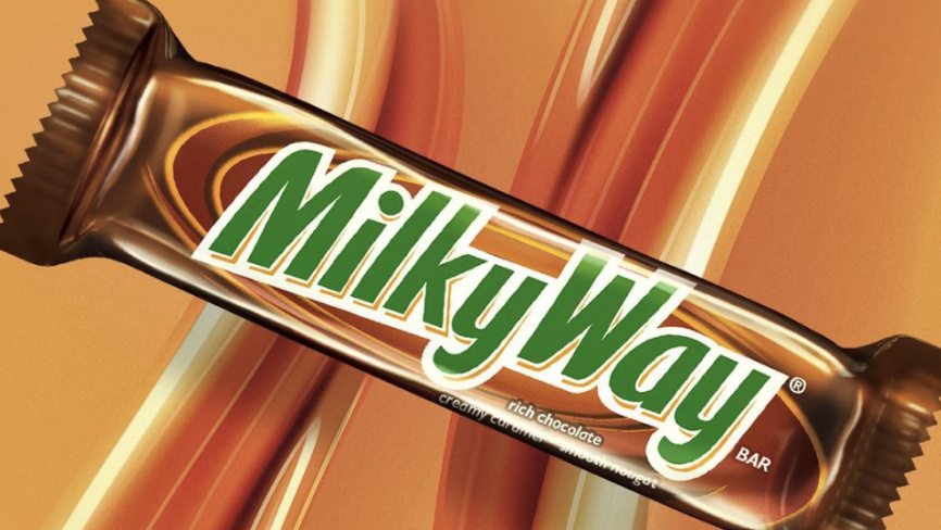 Packaged Original Milkyway bar on caramel-colored background