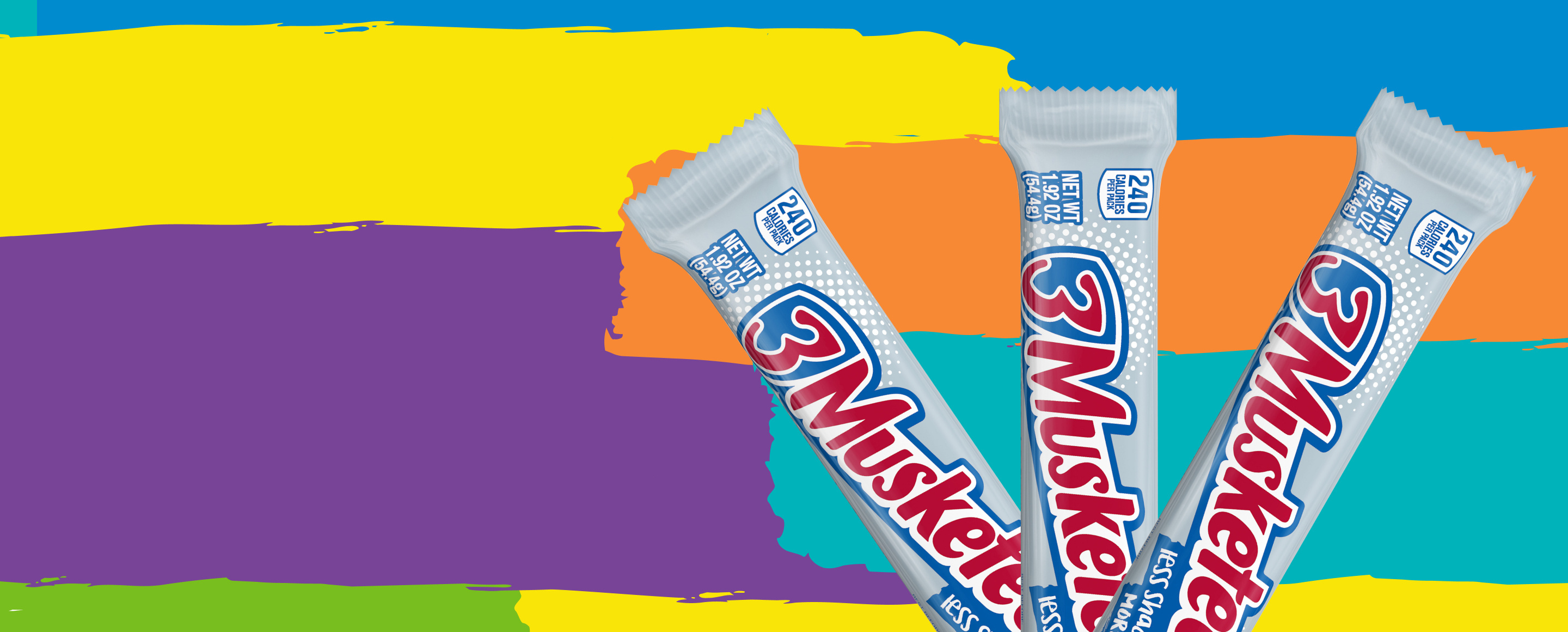 Three packaged 3 musketeers bars on colorful background