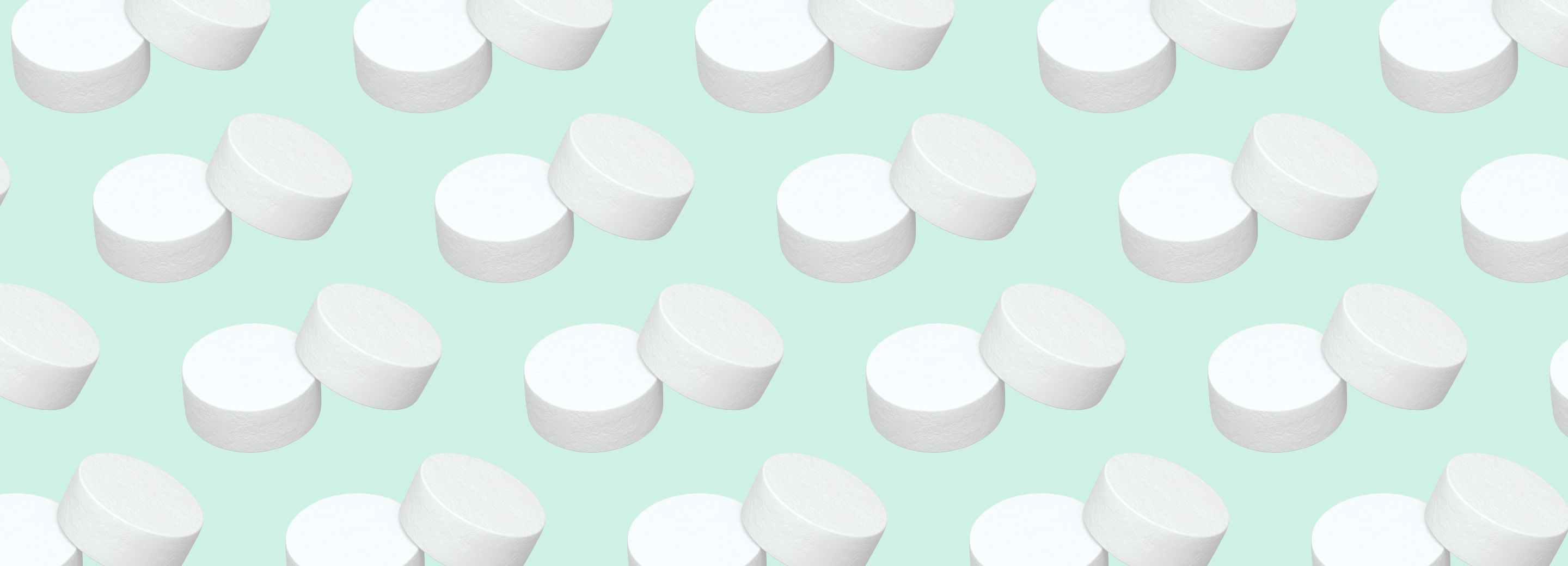 Pairs of Altoid mints repeated in a pattern on a mint green background
