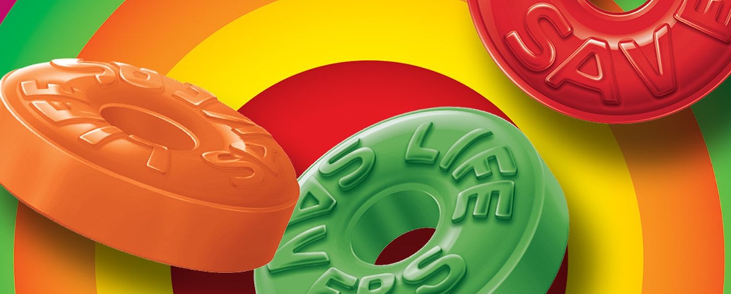 Zoomed in Life Savers gummies on top of colorful circular background
