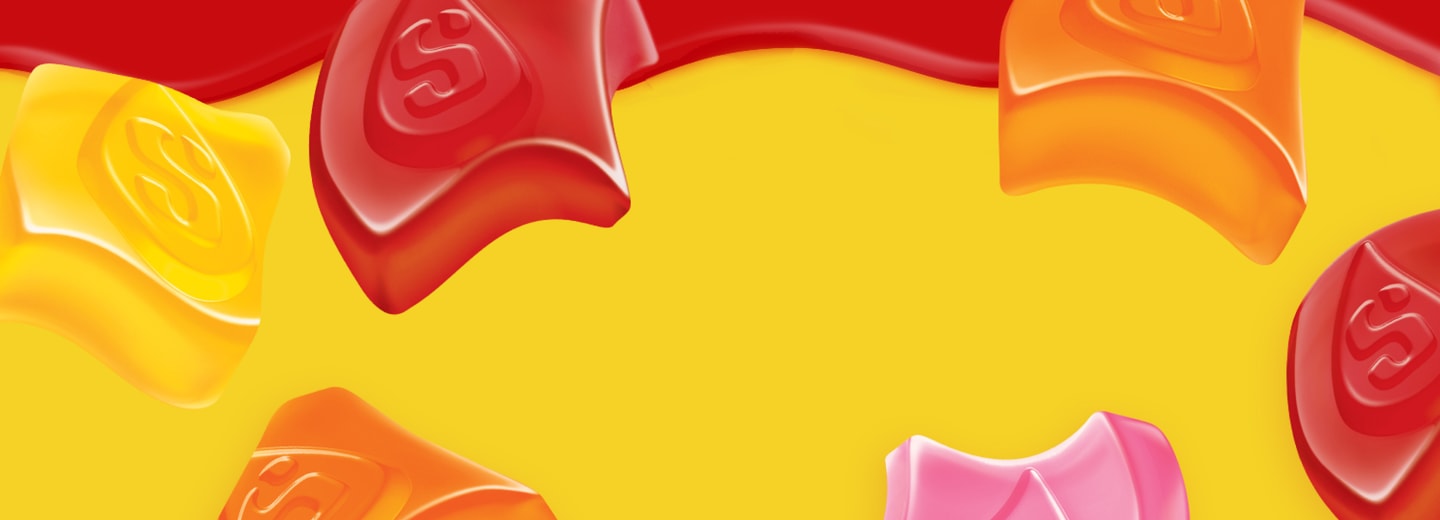 Close up of all the originals gummies flavors on a red and yellow background 