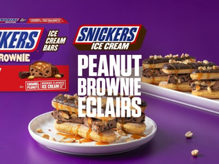 Plate of Snickers peanut brownie ice cream eclairs with text overlay
